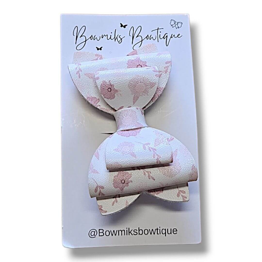 Handmade boutique hair accessories bow clip in pastel floral design from Bowmiks Boutique.
