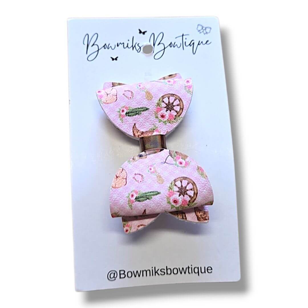 Cute pink bow clip from Bowmiks Boutique, perfect boutique hair accessories for kids.