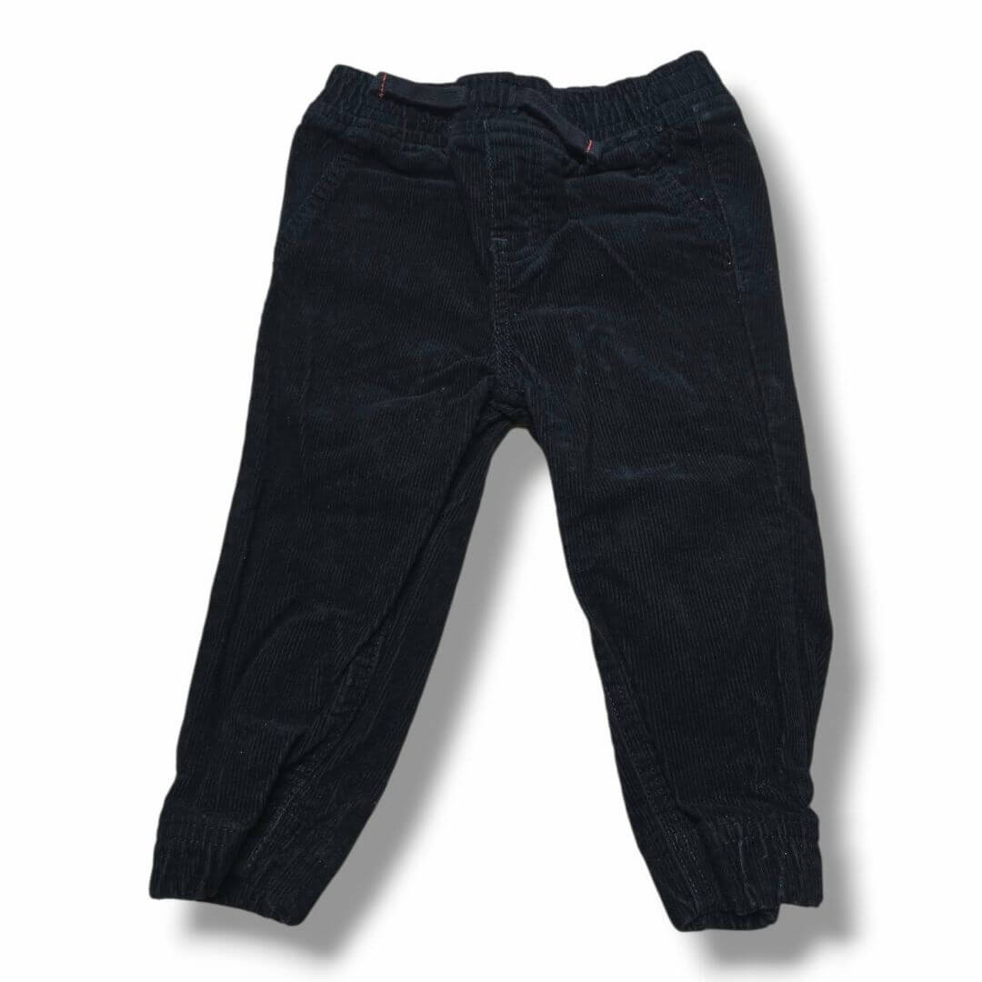Pre-loved children's corduroy pants in black with elastic waistband and cuffed ankles.