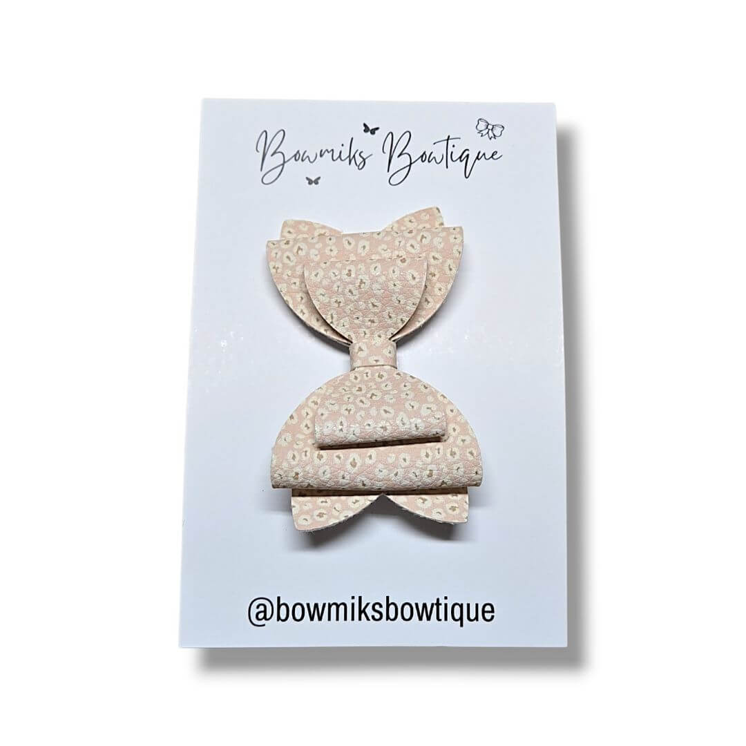 Handmade bow clip accessory featuring a stylish design from Bowmiks Boutique, perfect for little ones.