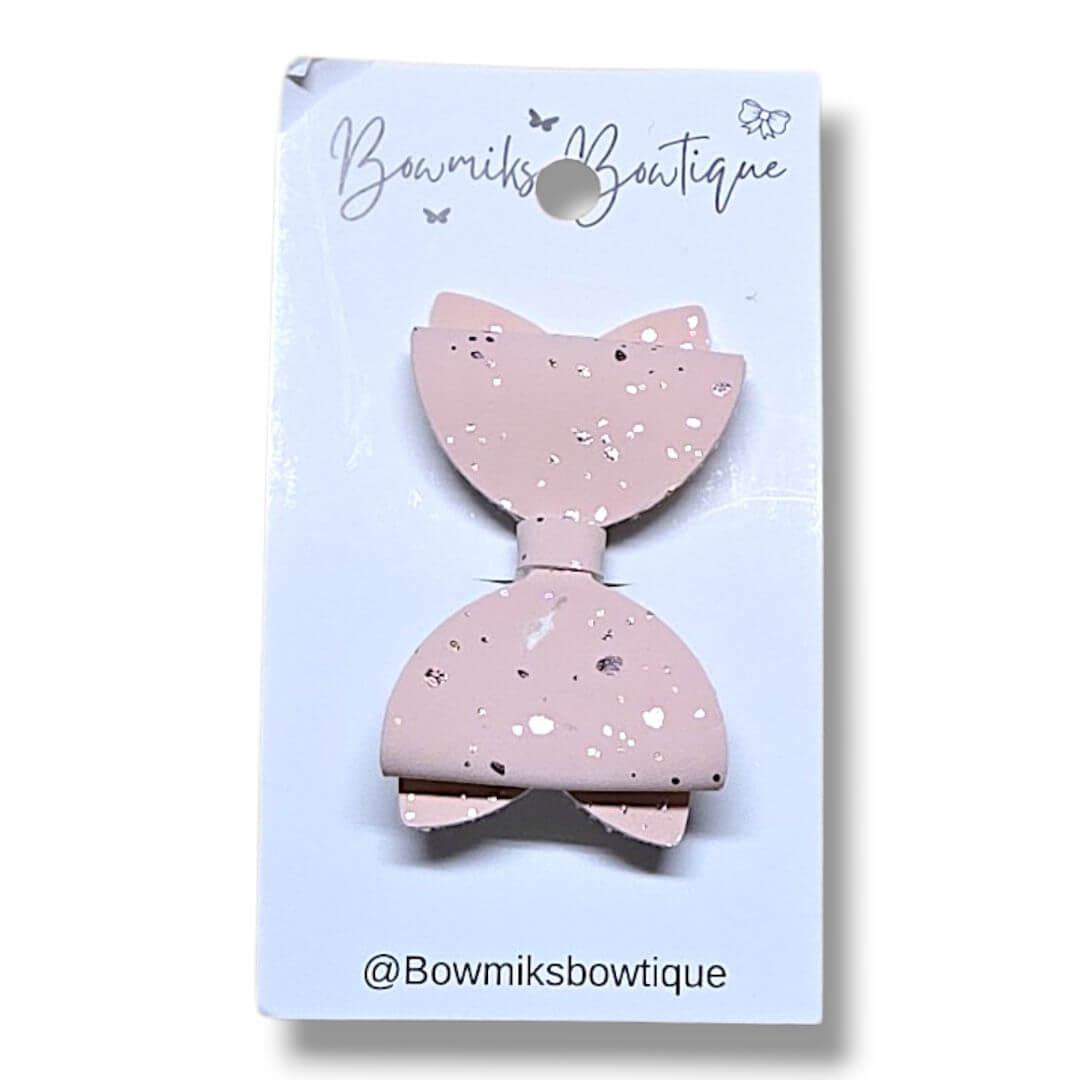 Bowmiks Boutique 2 inch handmade bow clip in soft pink with speckles, perfect for little ones.