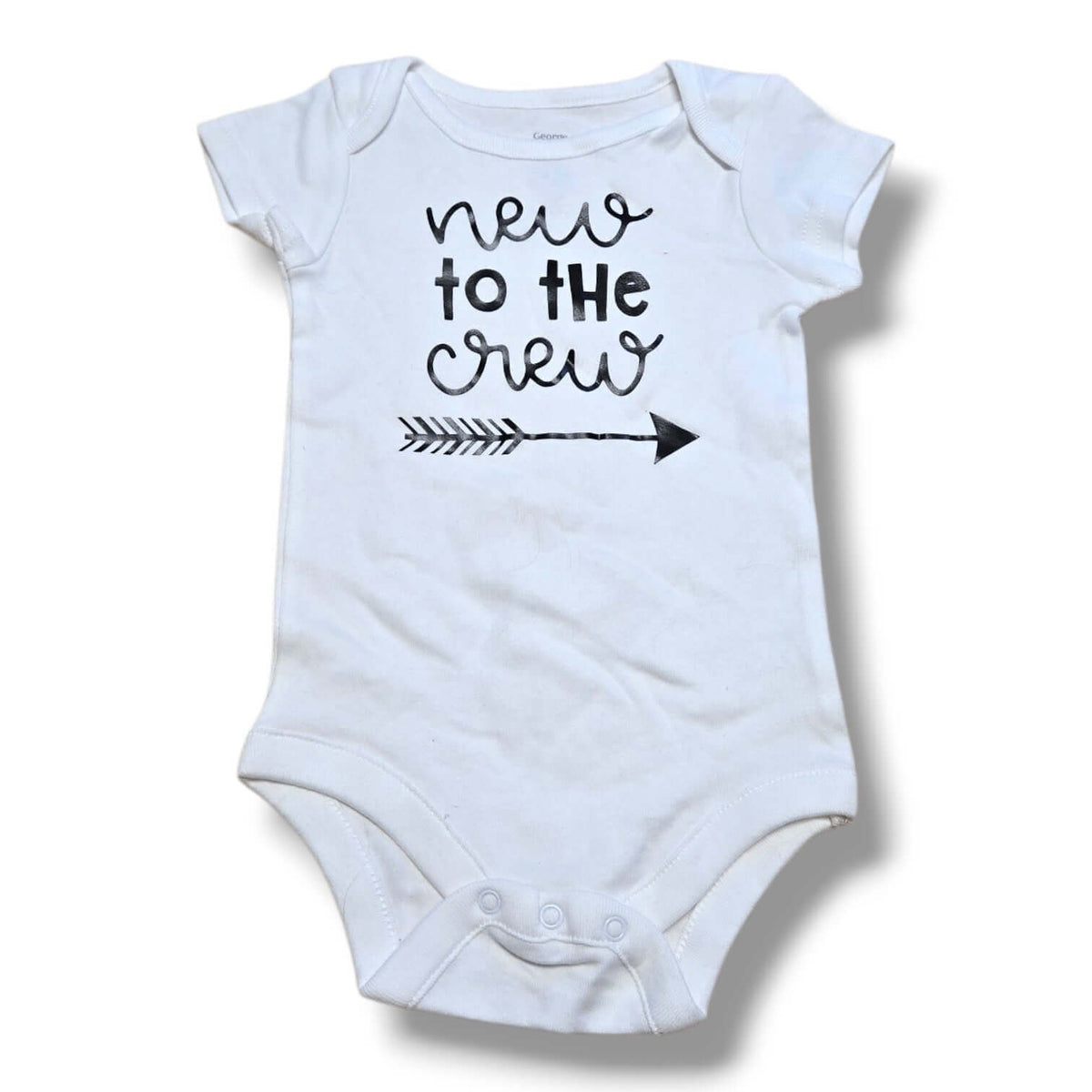 Pre-loved baby onesie featuring 'new to the crew' design and easy snap closures.