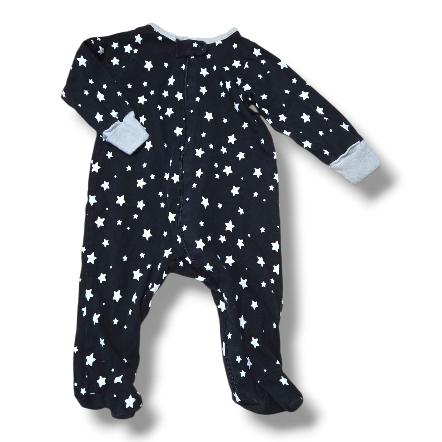 Pre-loved baby sleeper featuring a navy star pattern, lightly worn, perfect for comfort and snugging.