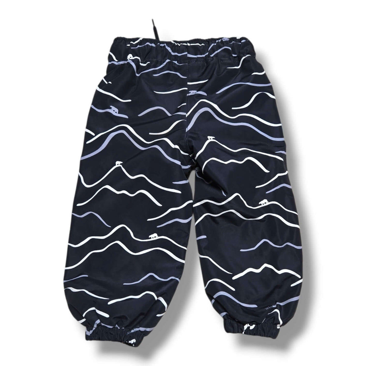 Jan & Jul pre-loved fleece lined rain pants featuring a navy wave pattern.