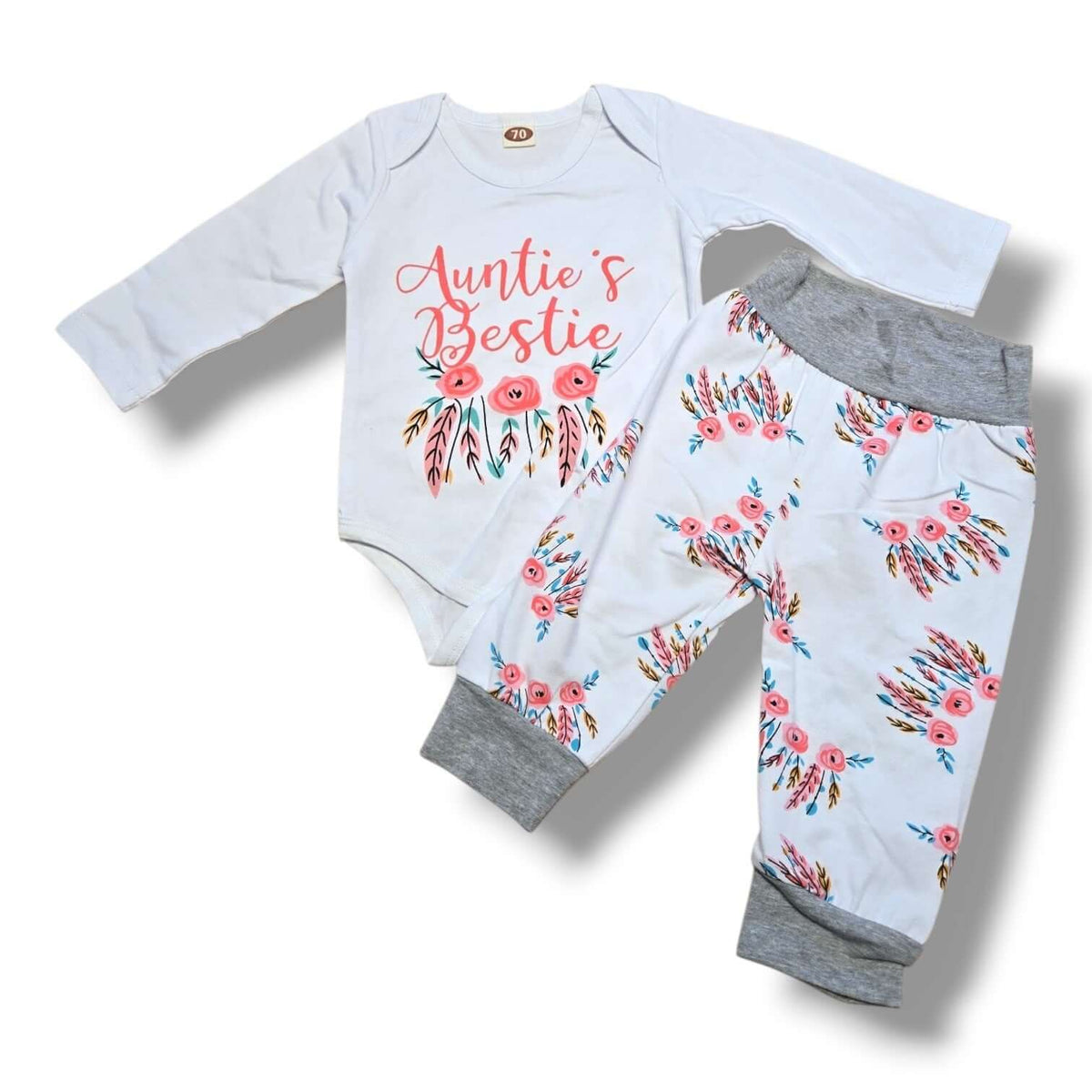 Size 3/6M preloved baby outfit set featuring "Auntie's Bestie" bodysuit and floral jogger pants.
