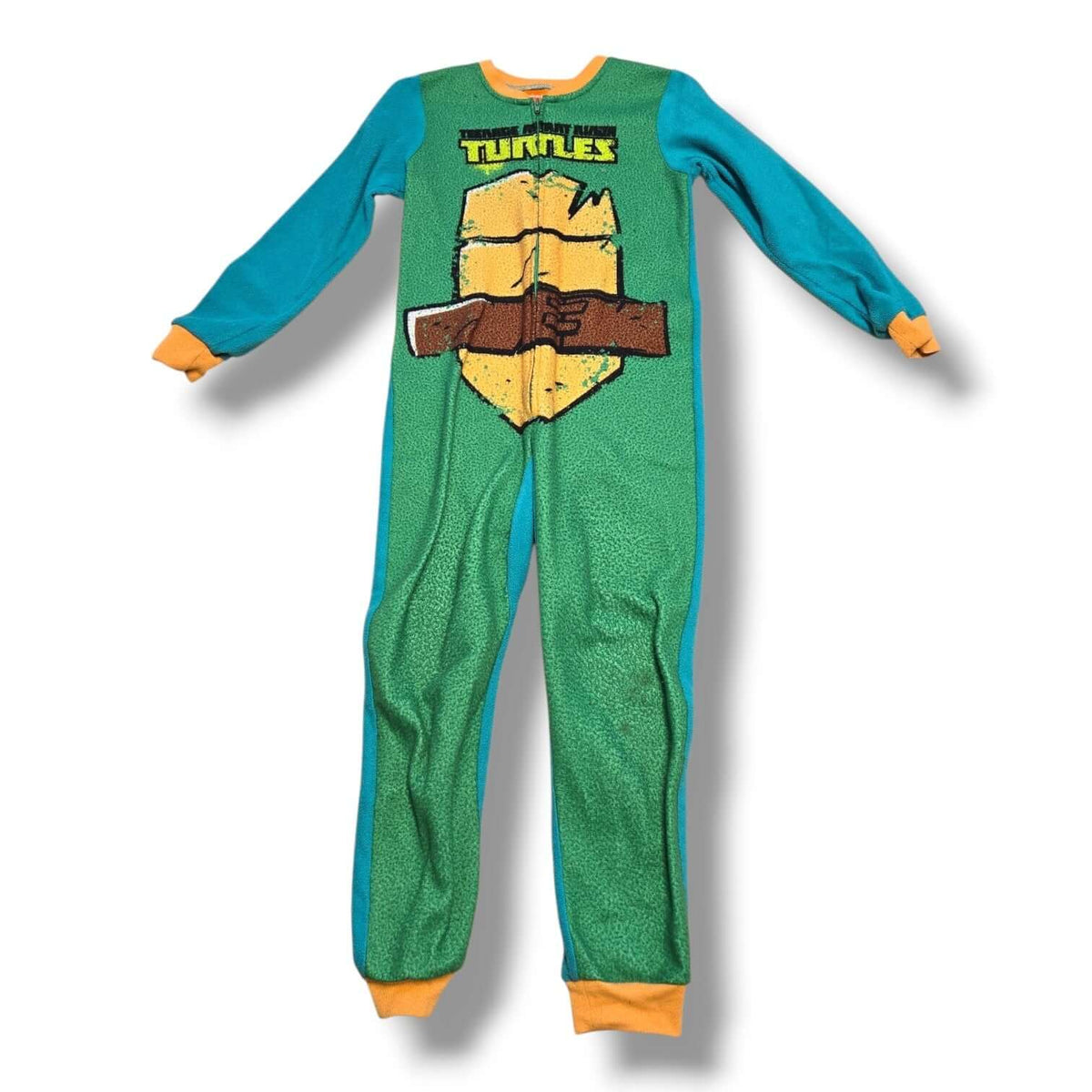 Pre-loved Nickelodeon TMNT sleeper displaying a fun shell design, perfect for cozy nights.