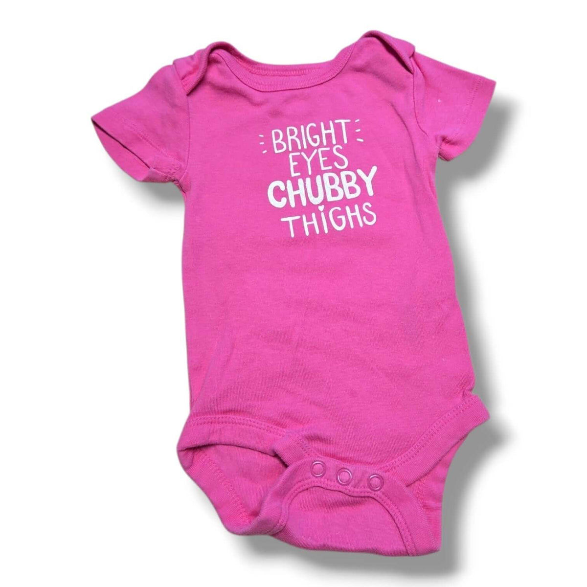 Bright pink pre-loved baby onesie with the phrase "Bright Eyes Chubby Thighs" for little ones.