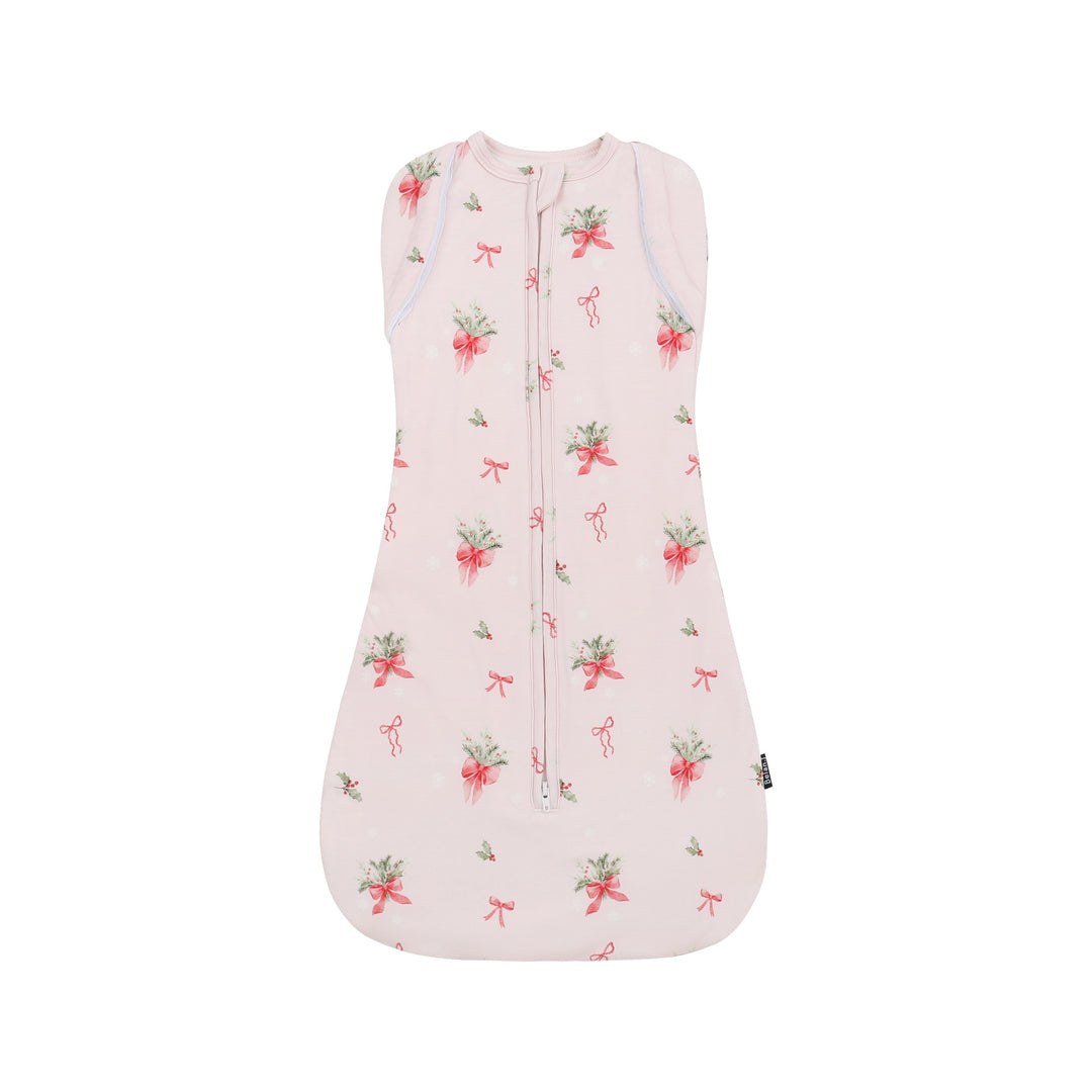 1.0 TOG convertible swaddle sack in pink bows design, perfect for a comfortable sleep.