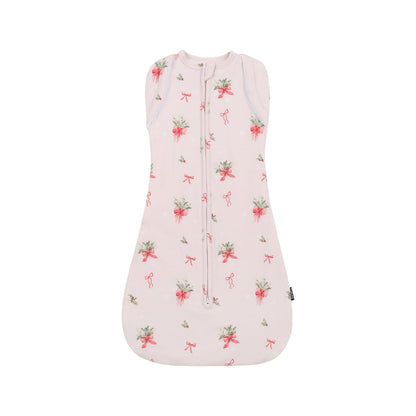 1.0 TOG convertible swaddle sack in pink bows design, perfect for a comfortable sleep.