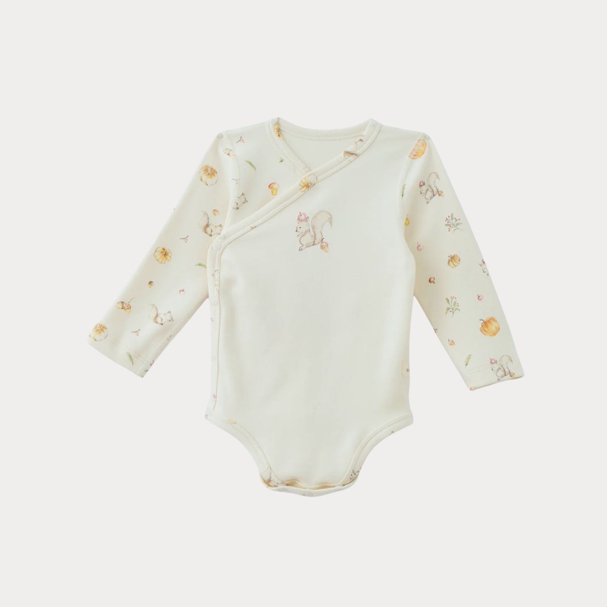 Organic cotton baby gift set featuring a long-sleeve bodysuit with playful prints for infants and toddlers.