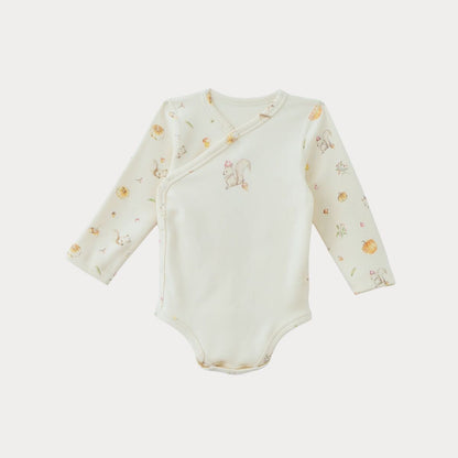 Organic cotton baby gift set featuring a long-sleeve bodysuit with playful prints for infants and toddlers.