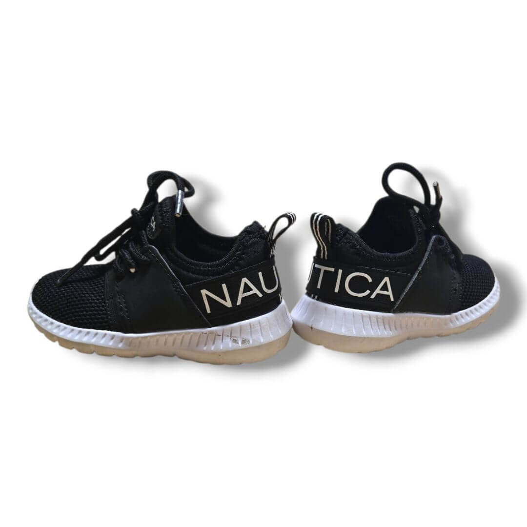 Nautica kids footwear size 6 in black with white soles and logo on the side.