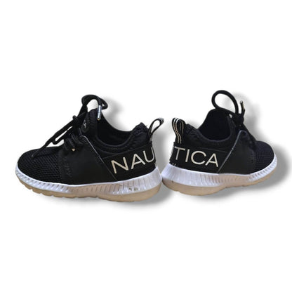 Nautica kids footwear size 6 in black with white soles and logo on the side.