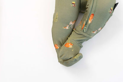 forest friends footed zipper sleeper showcasing woodland animals on soft olive-green fabric.