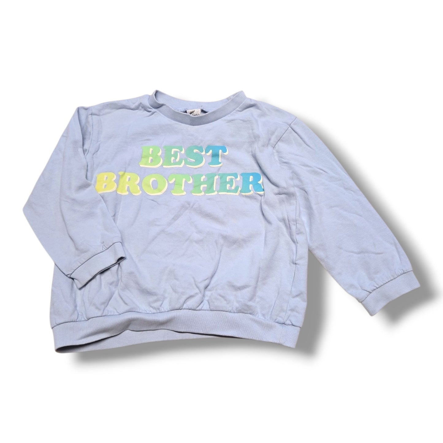 Pre-loved H&M toddler sweatshirt in light blue with "Best Brother" lettering for cozy wear.