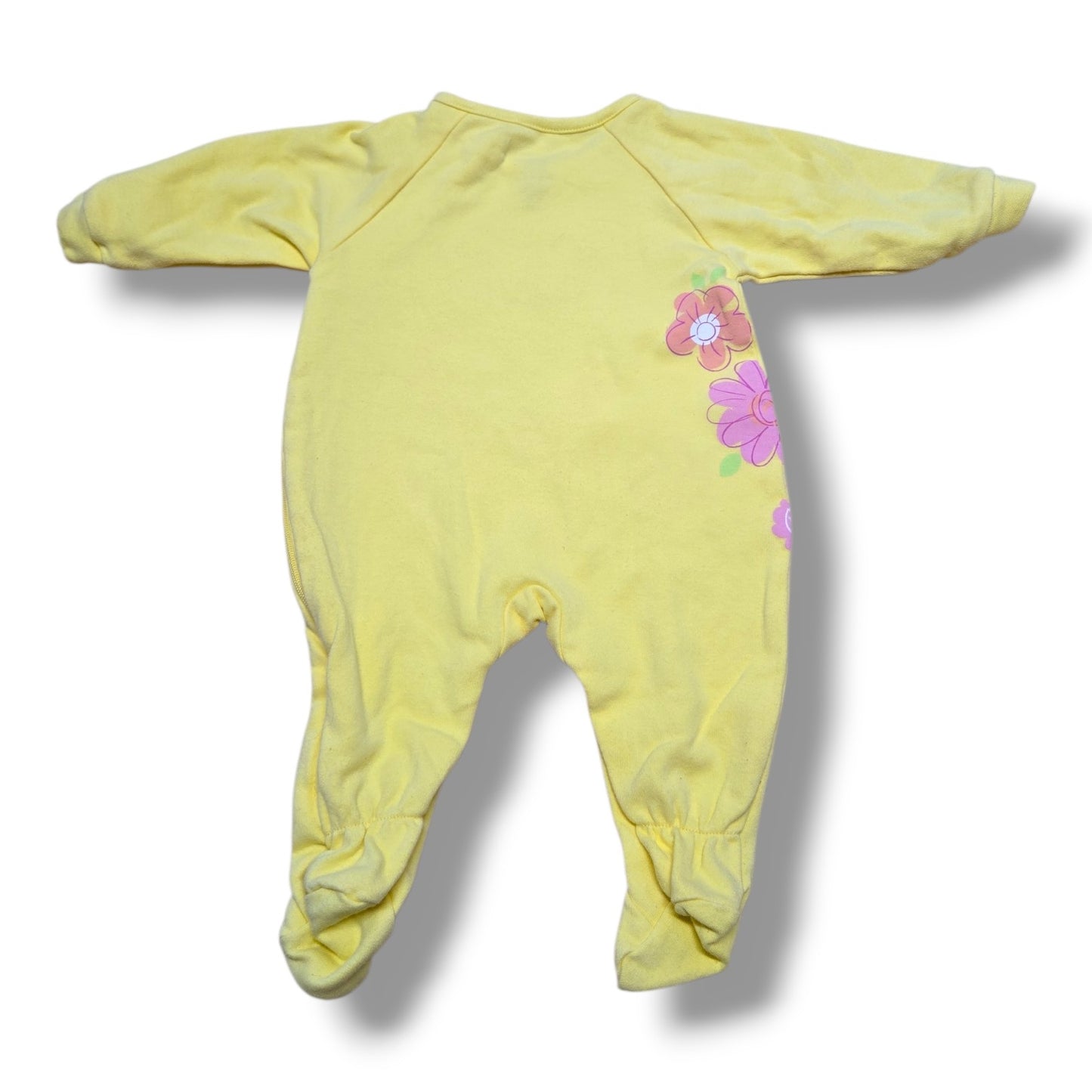 Pre-loved sleeper for cozy days in yellow with floral design, soft fabric, and comfy fit.