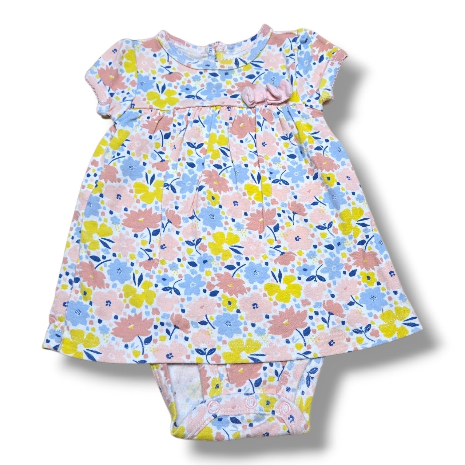 Pre-loved floral romper 3-6 months featuring a soft floral print in pastel colors with a bow detail.