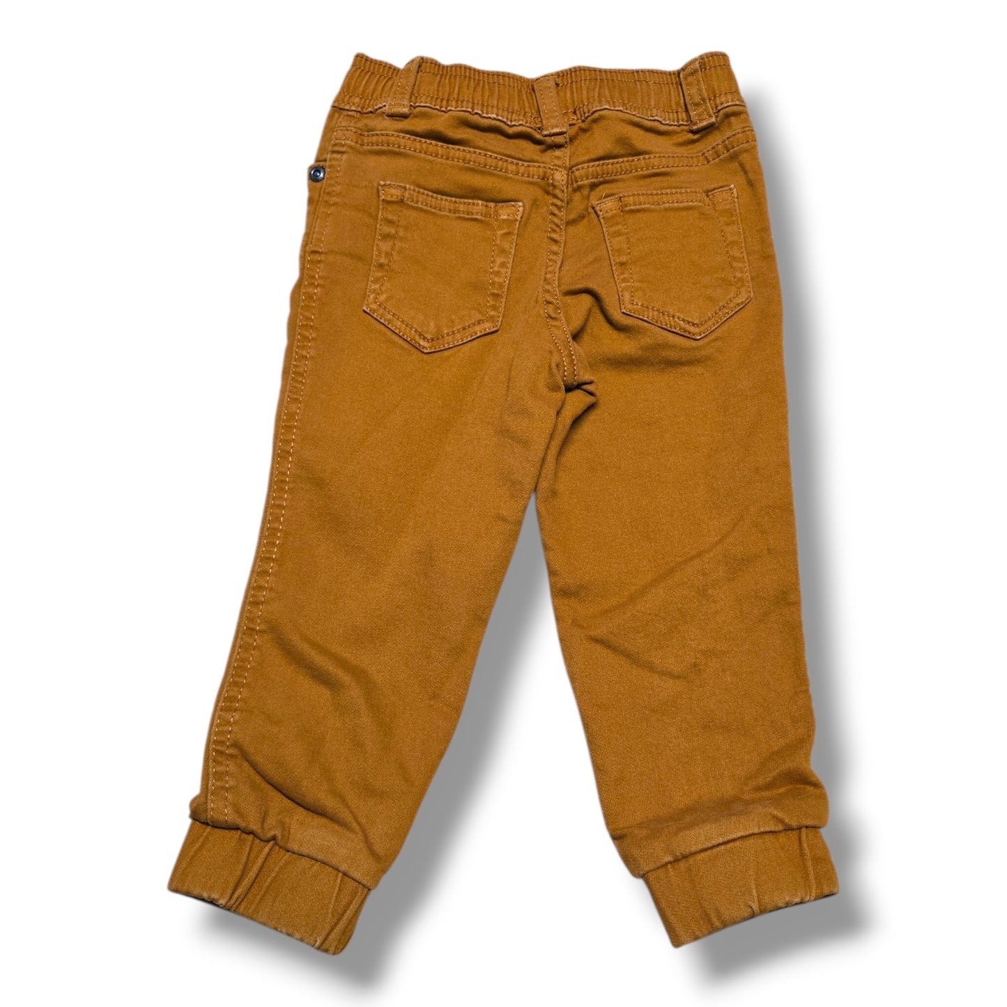 Back view of Joe Fresh pre-loved jogger pants in warm camel brown with elastic waistband and ribbed cuffs.