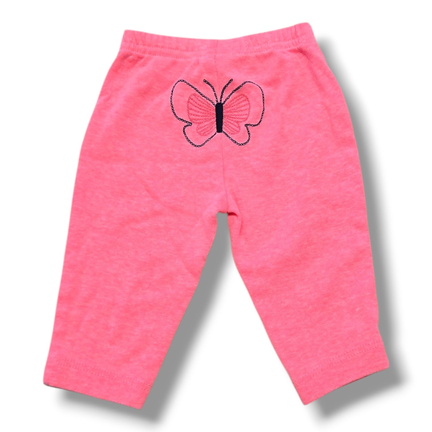 Preloved baby pants in soft pink with embroidered butterfly detail on the back, size 0-3 months.