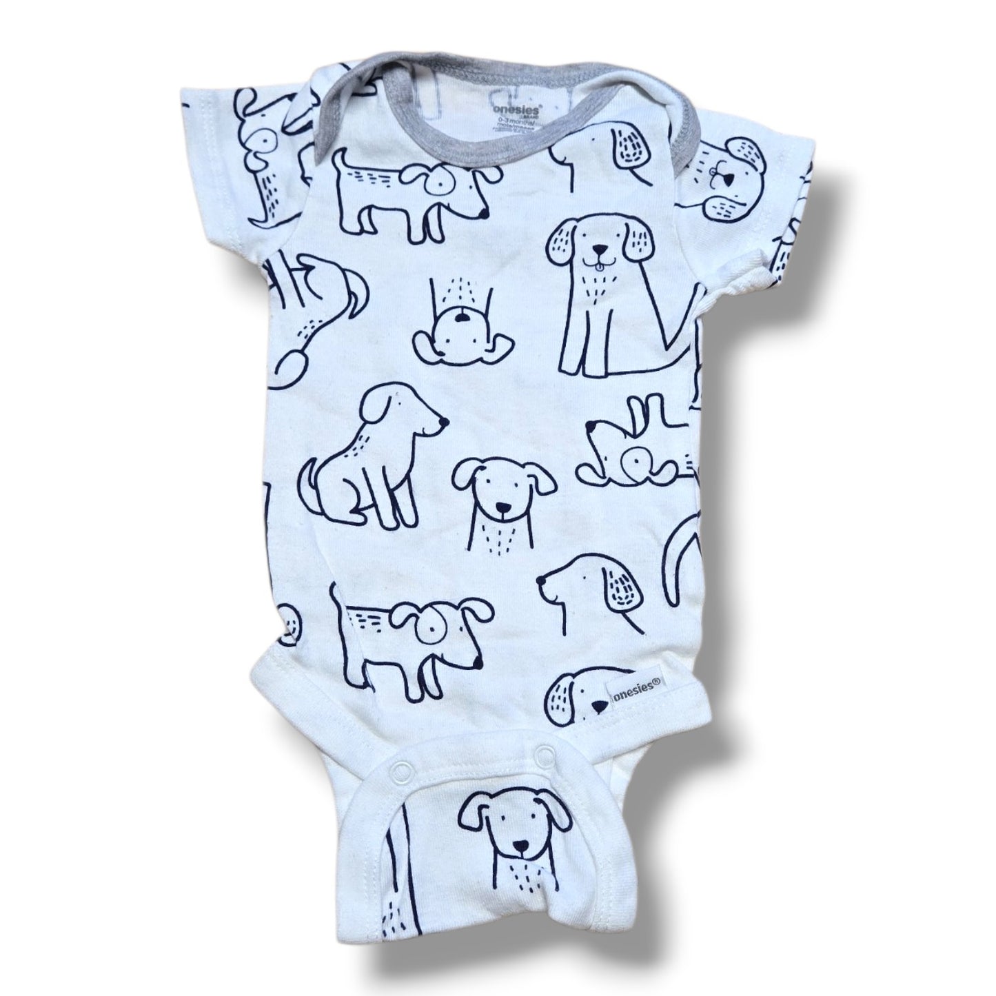 pre-loved baby onesie 0-3 months featuring playful dog print and easy snap closures.