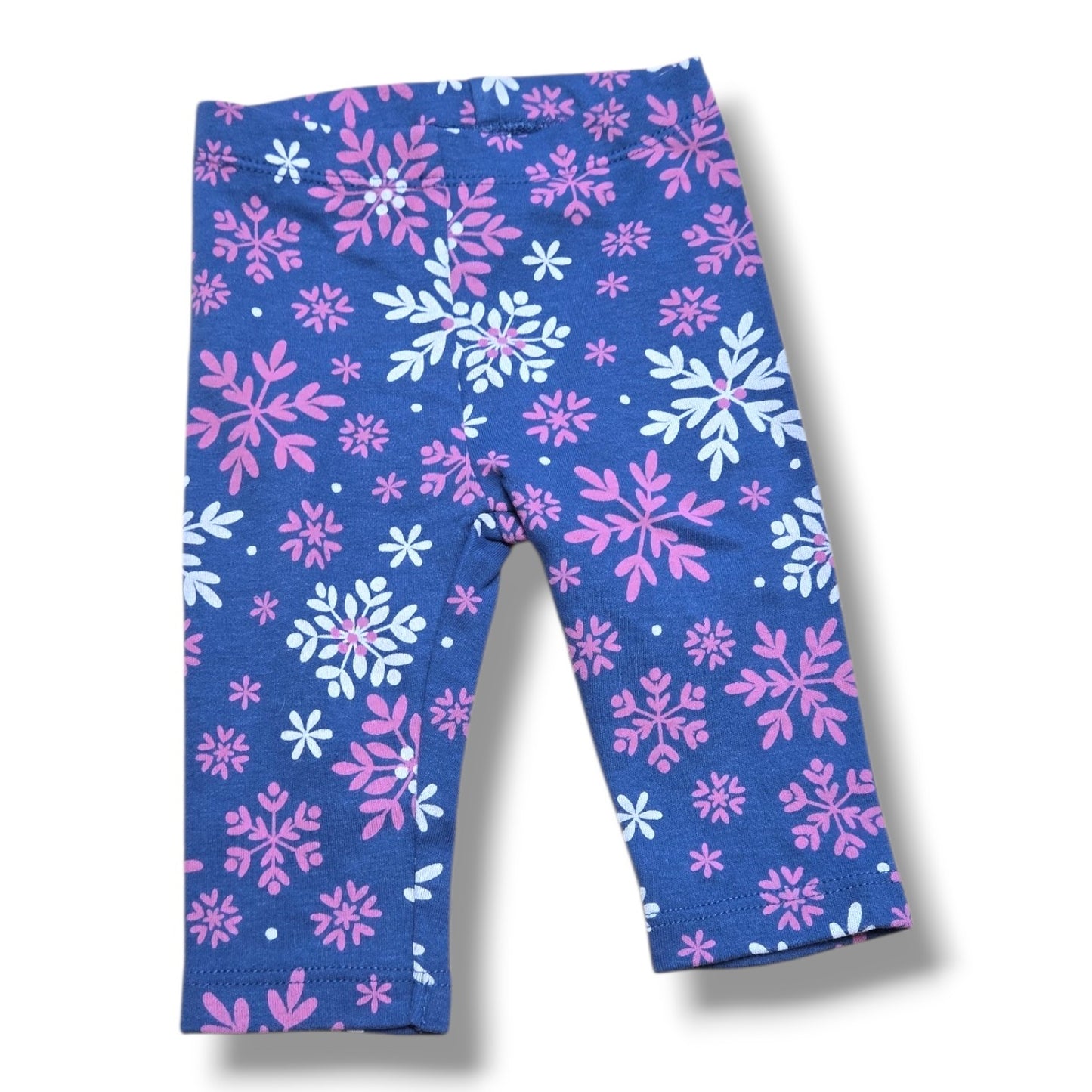 Pre-loved Pekkle leggings size 3 months with pink and white snowflake print on navy background.