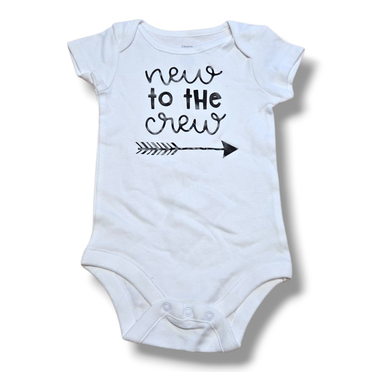 Pre-loved baby onesie featuring 'new to the crew' design and easy snap closures.