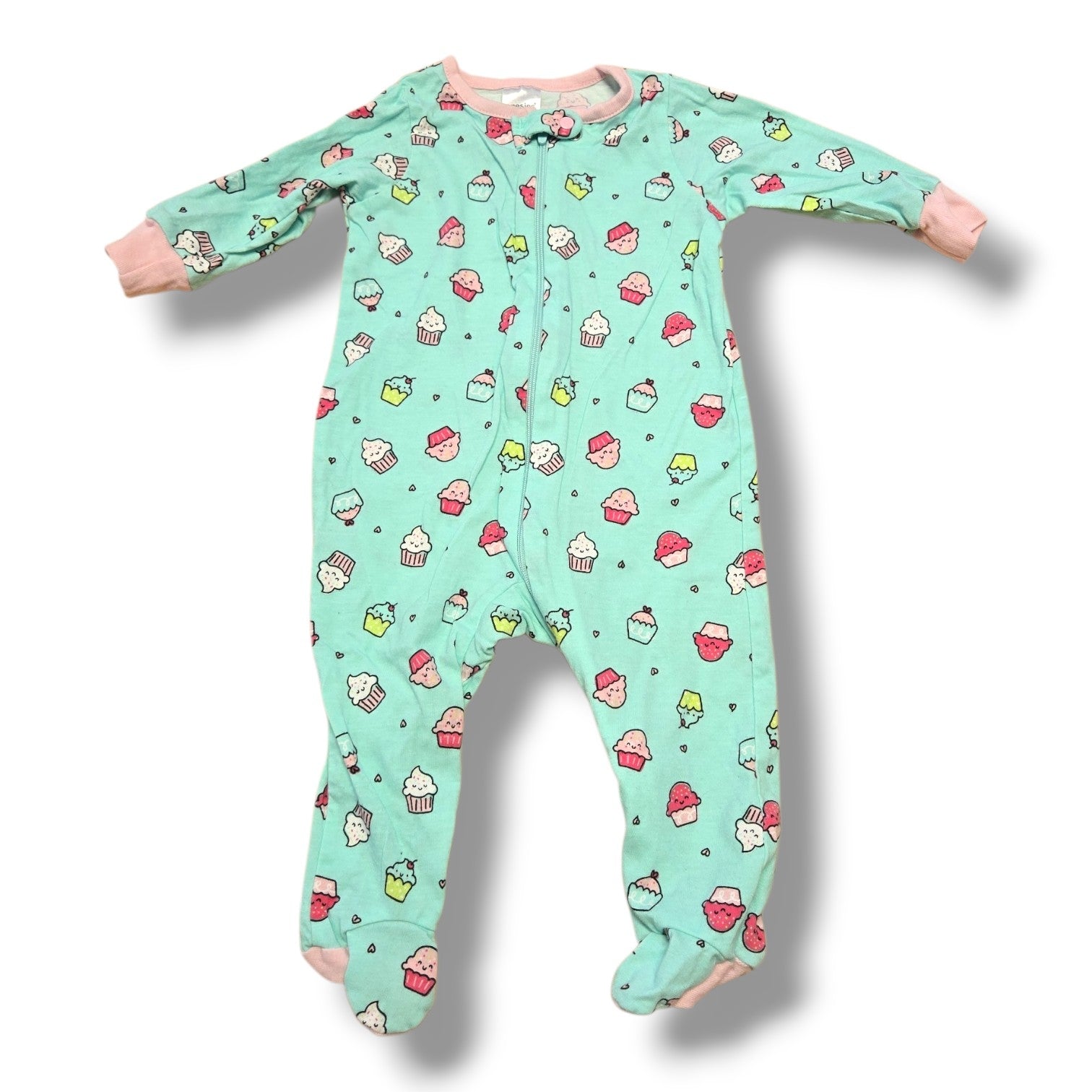 Pre-loved baby onesies featuring fun cupcake design in mint color, perfect for cozy days and naps.