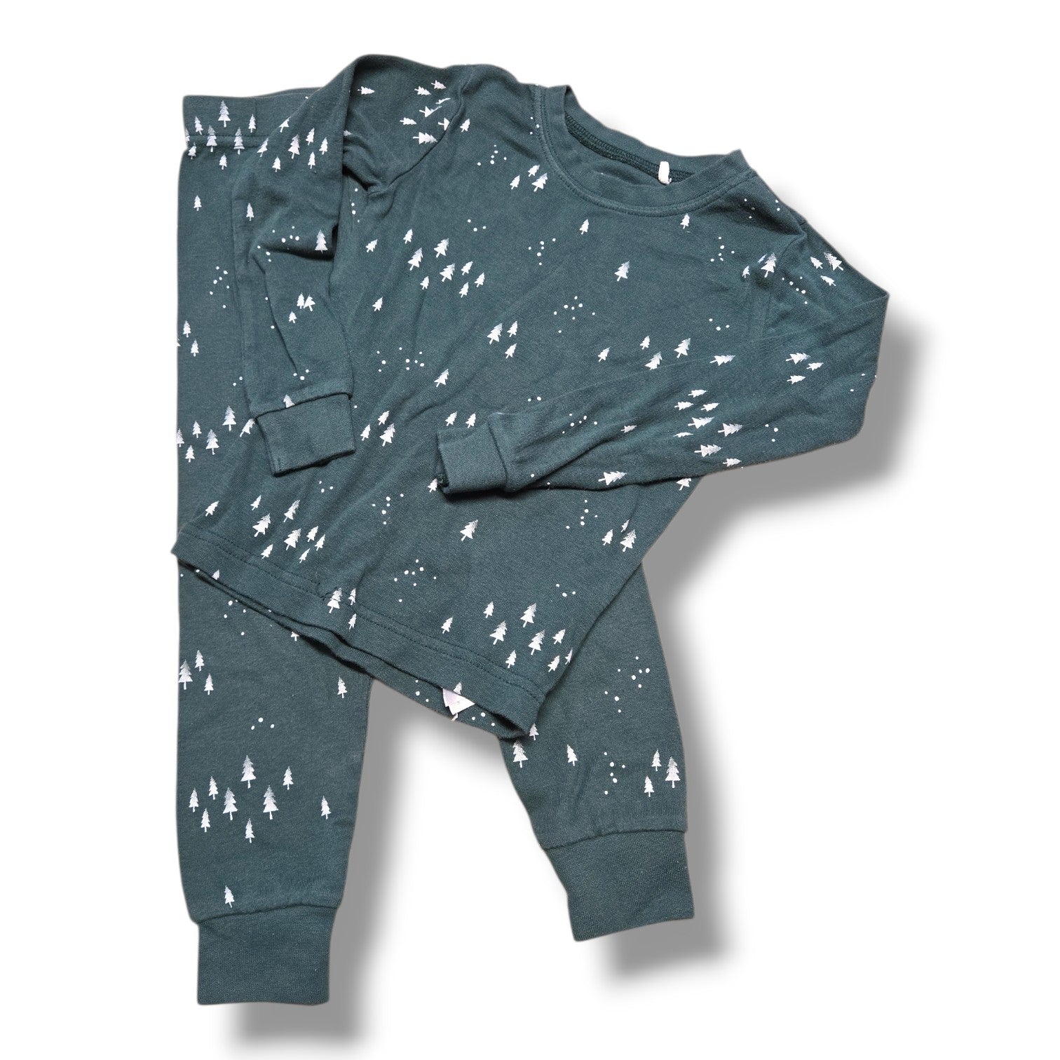 Soft pre-loved Petit Lem pajama set in forest tree print, featuring long sleeve top and cuffed pants.