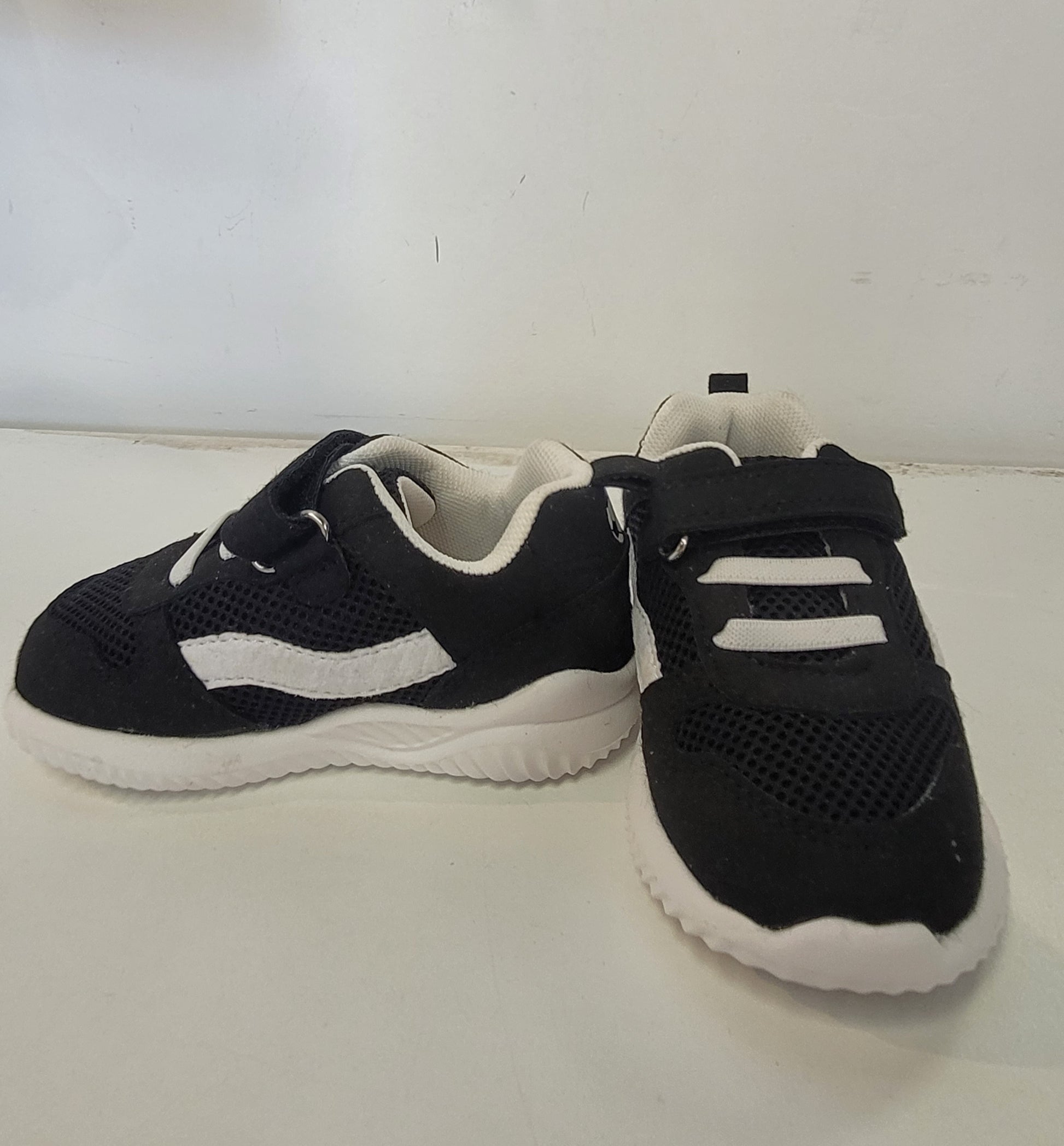 Lightweight EVA sneakers for kids in black, featuring a stylish mesh design, perfect for active children.
