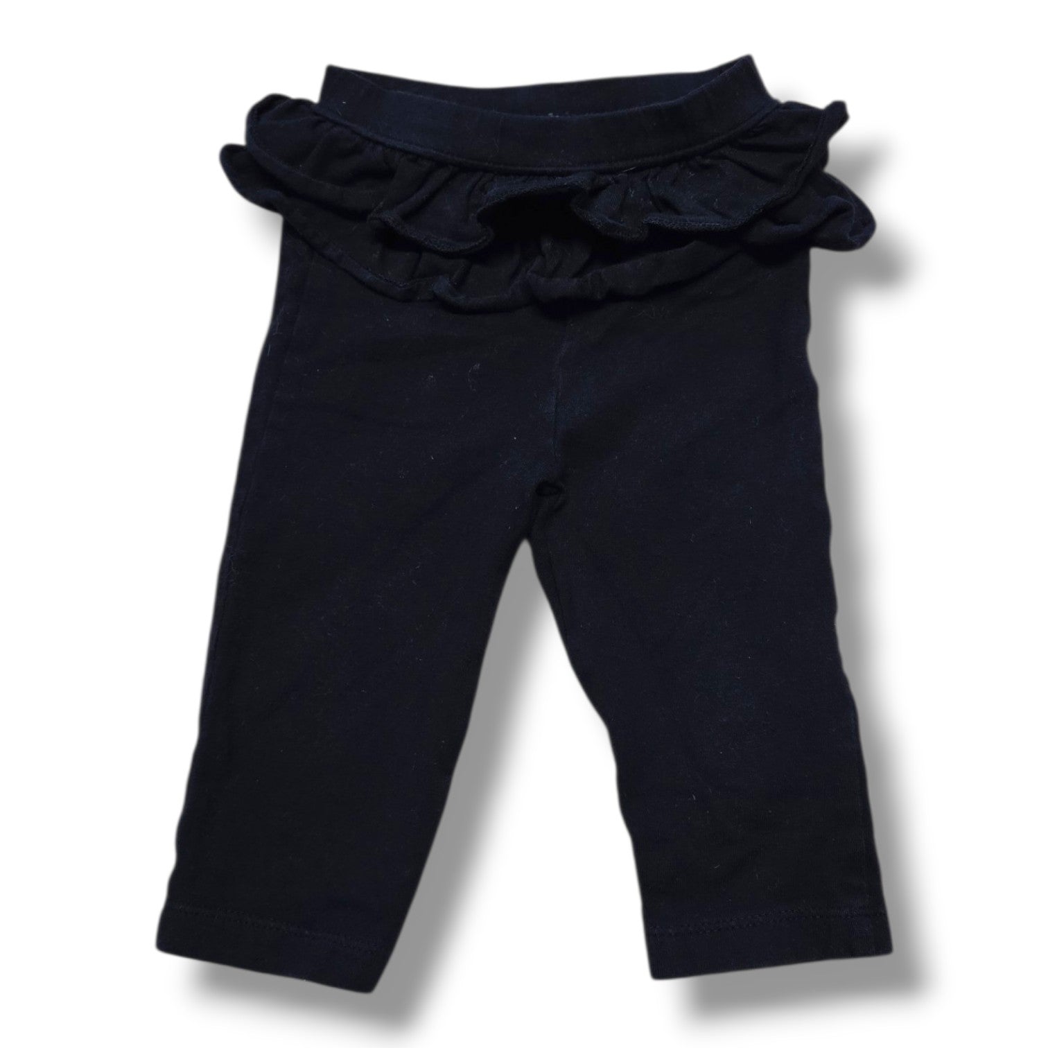 Pre-loved baby leggings 3-6 months in soft black with ruffle waist detail, perfect for everyday outfits.