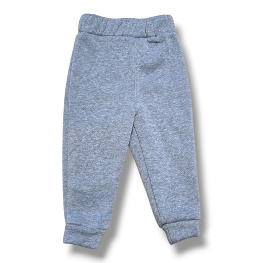 Bearpaw pre-loved fleece pants 3-6 months in soft grey color, featuring elastic waistband and cuffed ankle design.