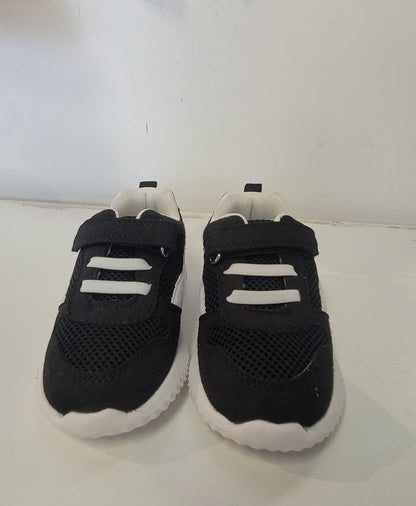 Lightweight EVA sneakers for kids in black with white accents, designed for comfort and style.