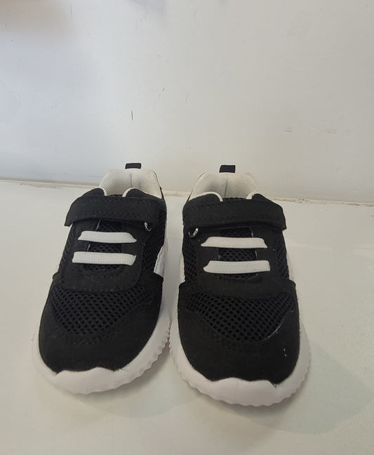 Lightweight EVA sneakers for kids in black with white accents, designed for comfort and style.