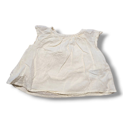 Old Navy preloved baby t-shirt 3-6 months in cream with flutter sleeves and Swiss dot fabric.