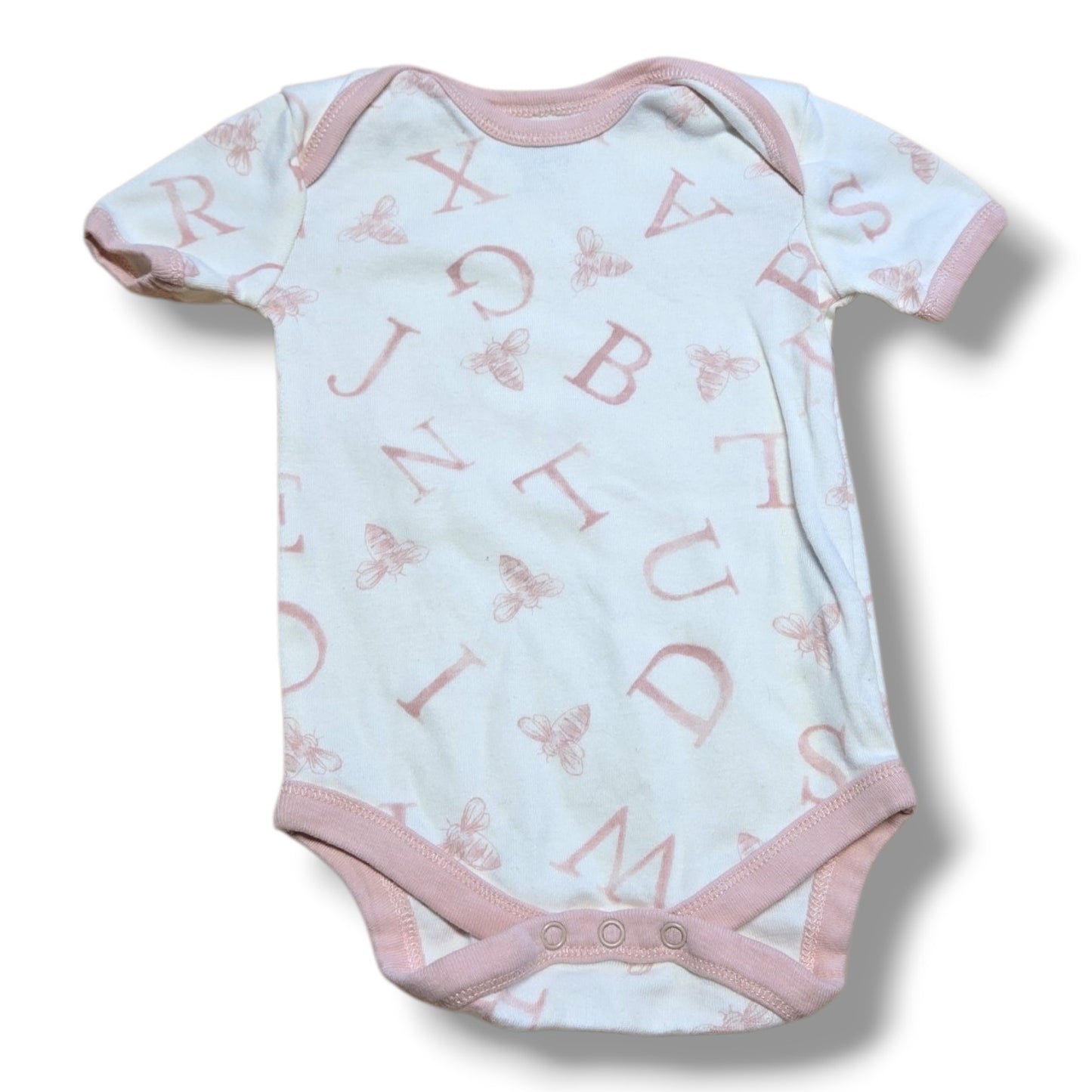 Burts Bees Baby pre-loved baby onesie in mint condition with alphabet and bee print, perfect for infants.