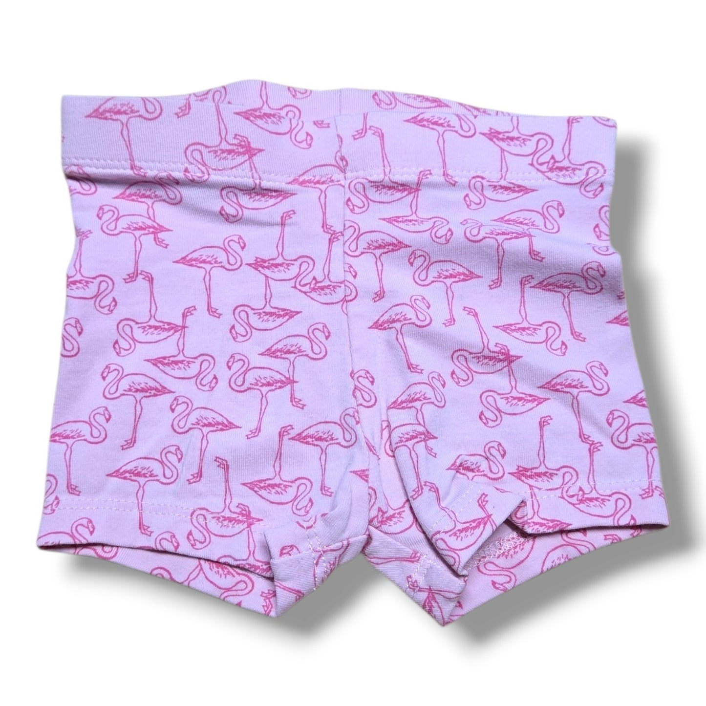 Preloved quality baby shorts in light purple with pink flamingo pattern, perfect for playtime and layering.