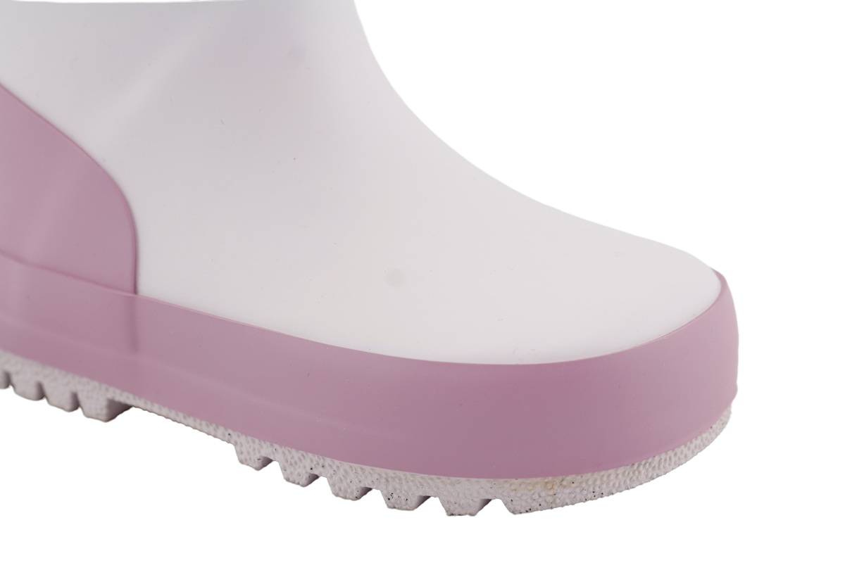 kids waterproof rain boots pink close-up view showing pink and white design.