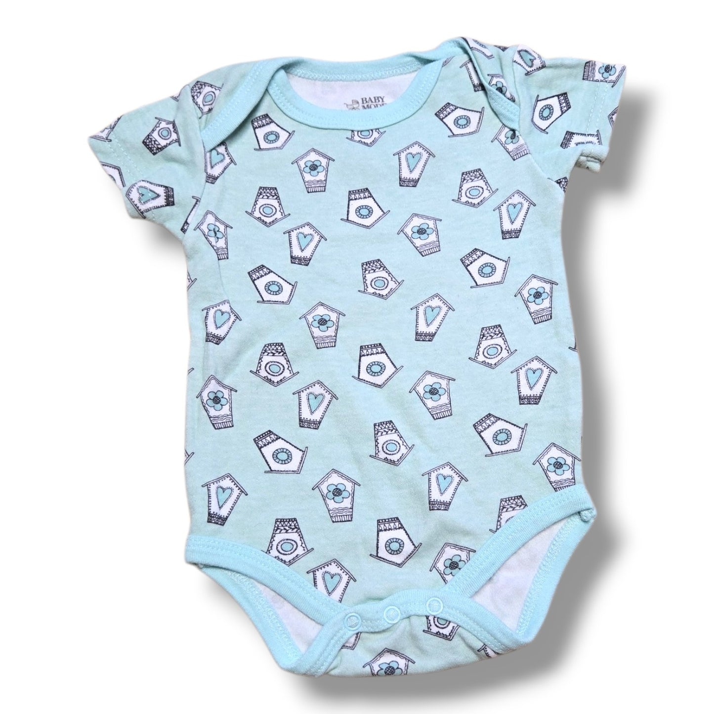 Pre-loved baby onesie in mint condition, featuring cute house patterns and easy snap closures for quick changes.