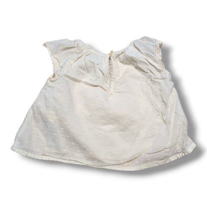 Old Navy preloved baby t-shirt 3-6 months with flutter sleeves in cream color and Swiss dot fabric.