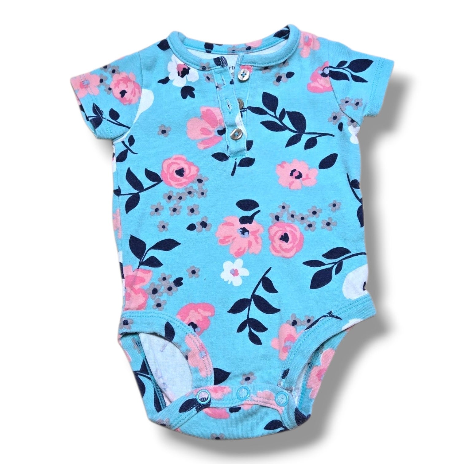 Pre-loved baby onesie in mint condition with floral pattern, perfect for everyday wear.
