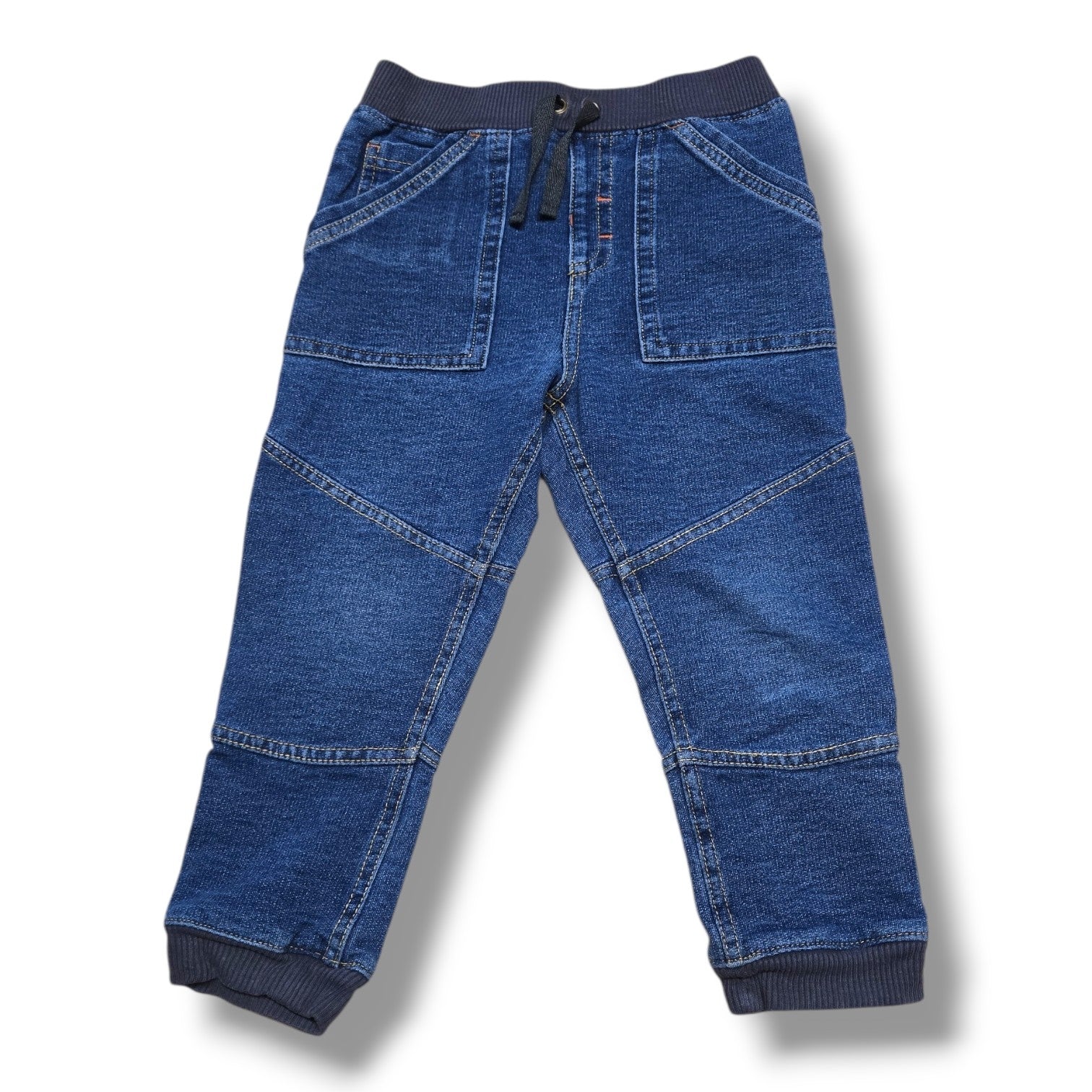 Size 2T soft denim joggers featuring an elastic waistband and ribbed cuffs in a medium wash.