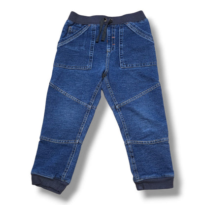 Size 2T soft denim joggers featuring an elastic waistband and ribbed cuffs in a medium wash.