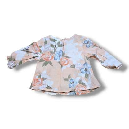 Old Navy pre-loved baby blouse 3-6 months in soft peach floral print with long sleeves and button closure.