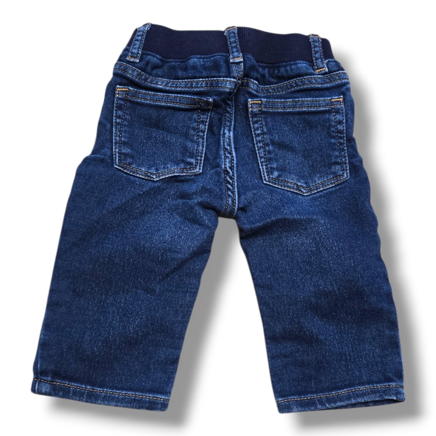 Preloved straight leg jeans 6-12 months featuring a soft rib-knit waistband and classic five-pocket styling.
