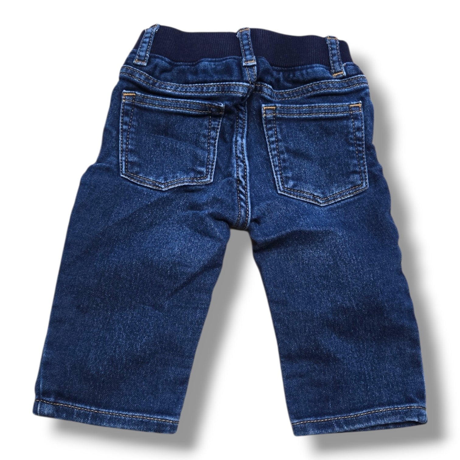 Preloved straight leg jeans 6-12 months featuring a soft rib-knit waistband and classic five-pocket styling.