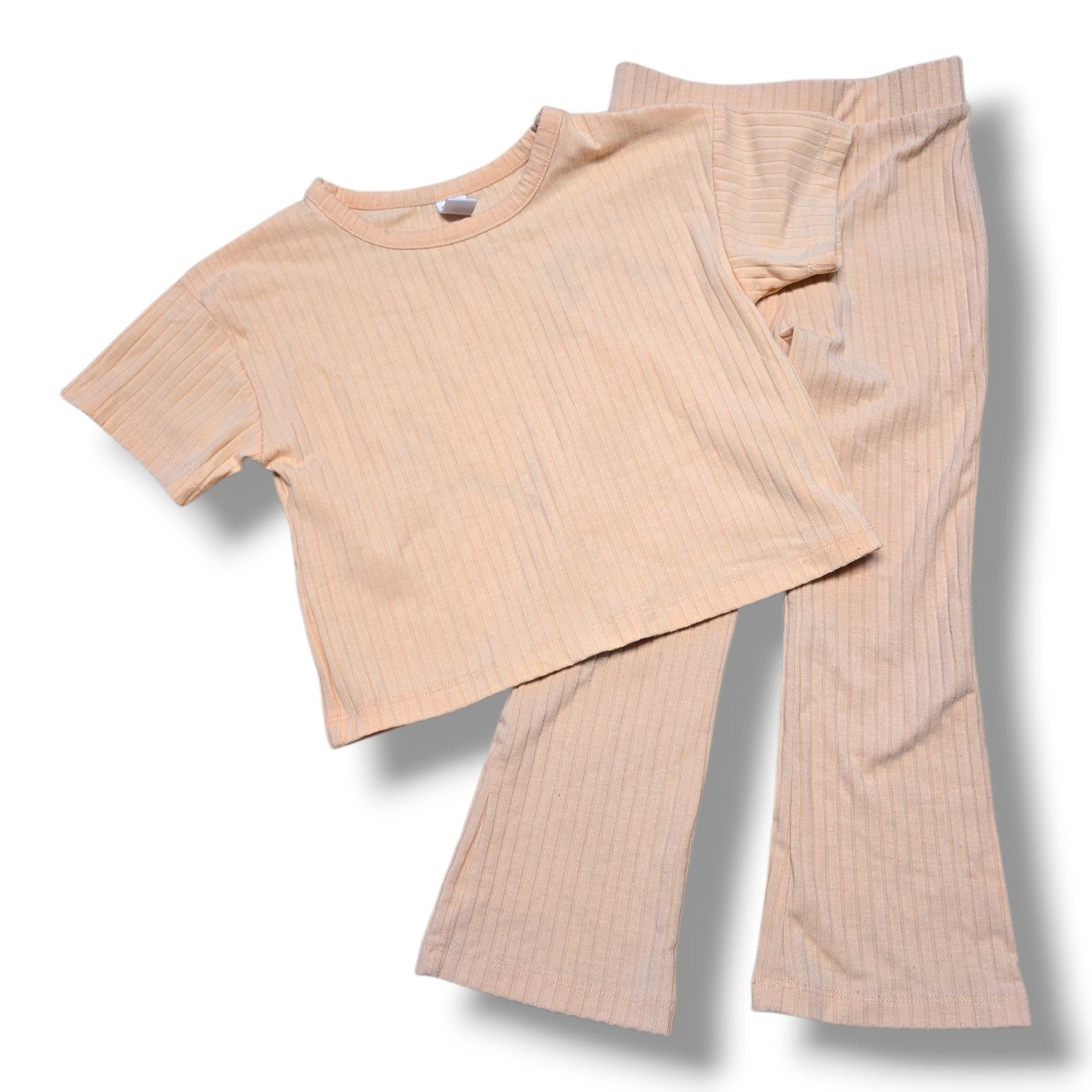 Joe Fresh pre-loved toddler ribbed outfit set in soft peach color, includes short sleeve top and flared pants.