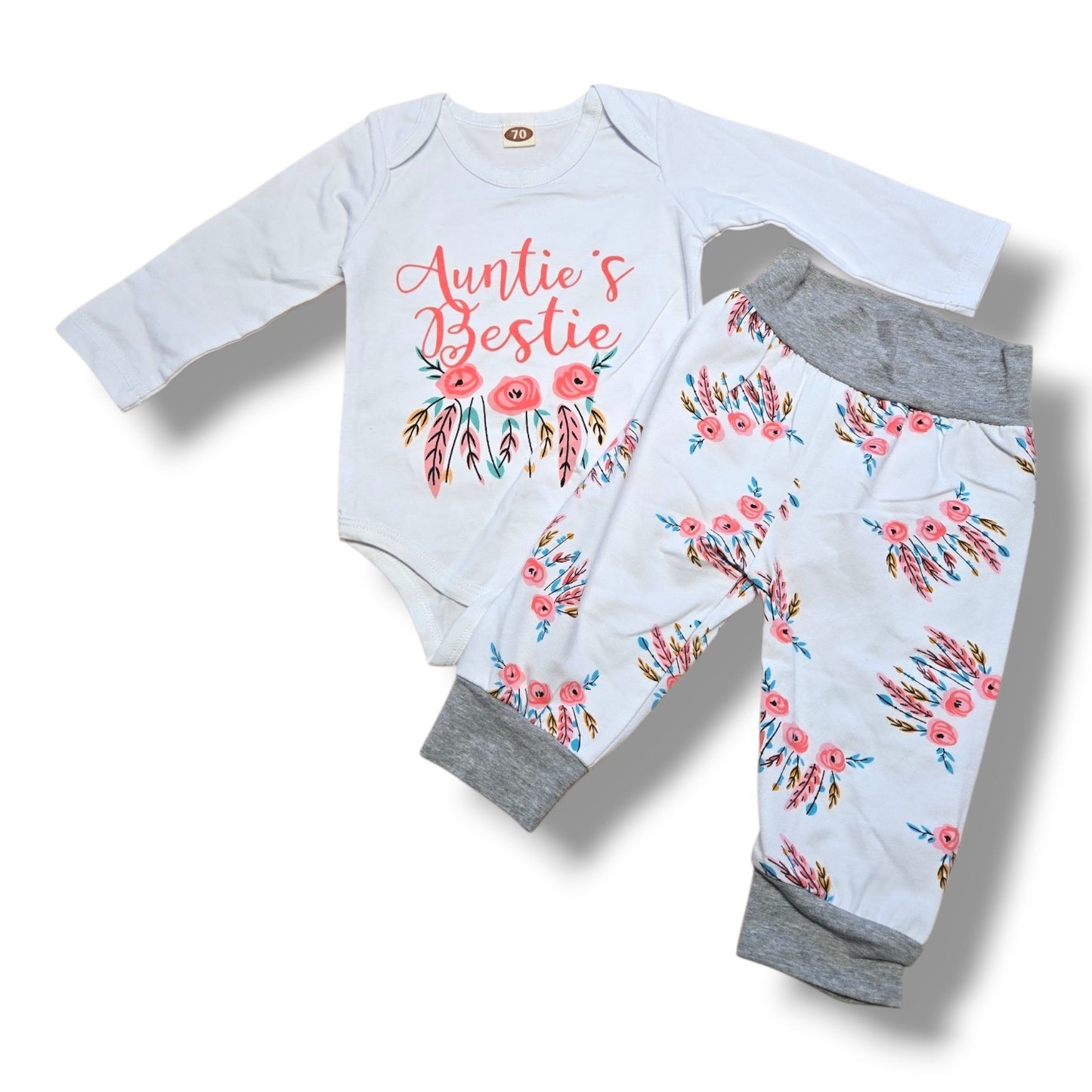Size 3/6M preloved baby outfit set featuring "Auntie's Bestie" bodysuit and floral jogger pants.