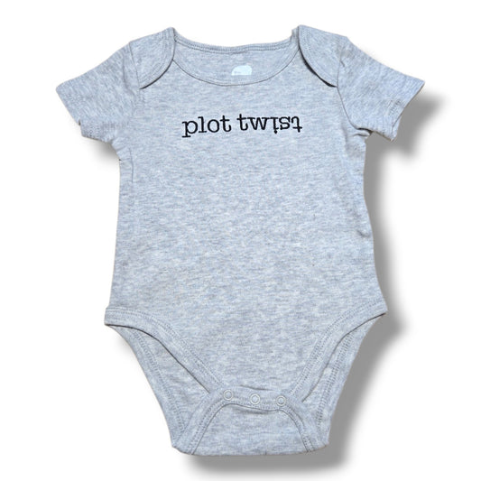 The Littlest pre-loved baby onesie in grey with plot twist printed design, perfect for fun outfits.