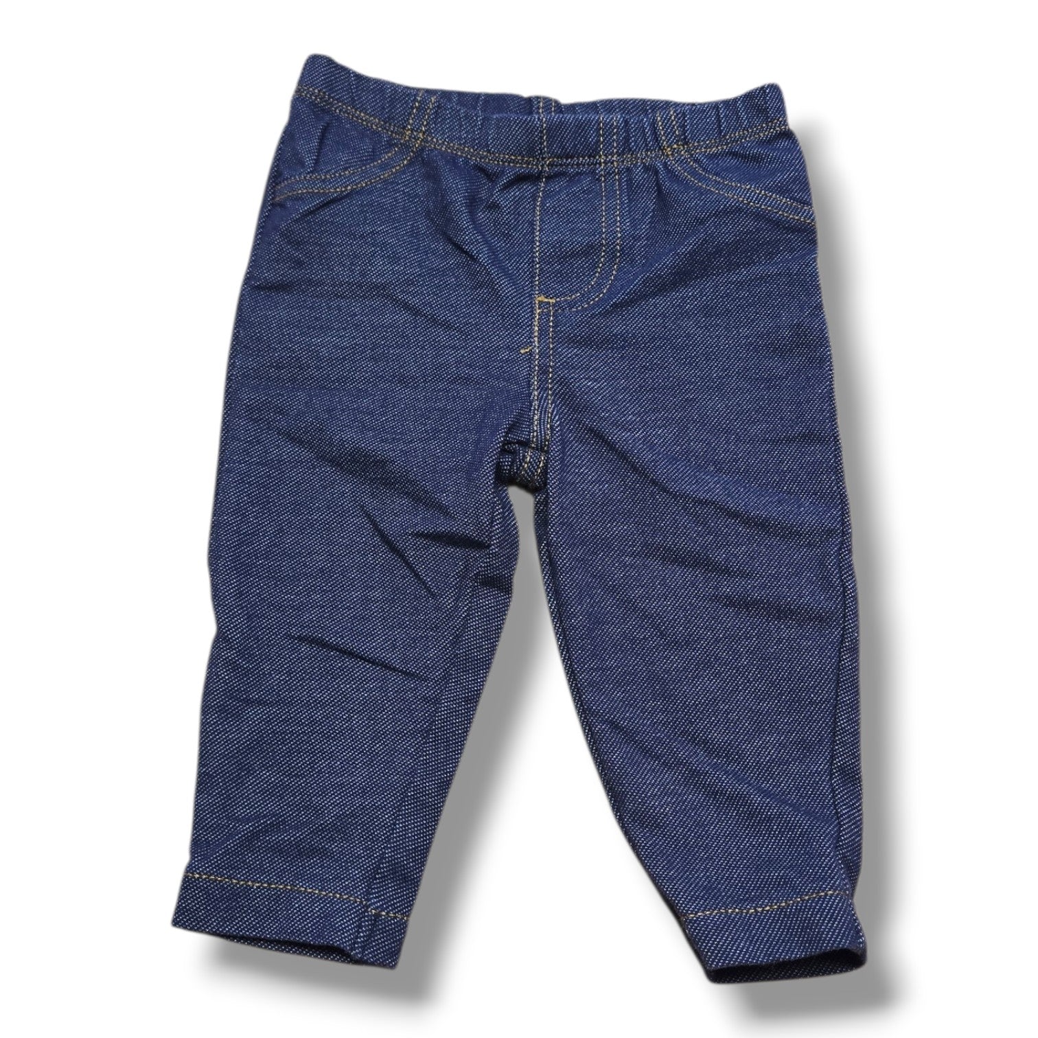 Pre-loved Carter's pants for infants, size 6M pull-on jeggings with classic denim look and elastic waistband.