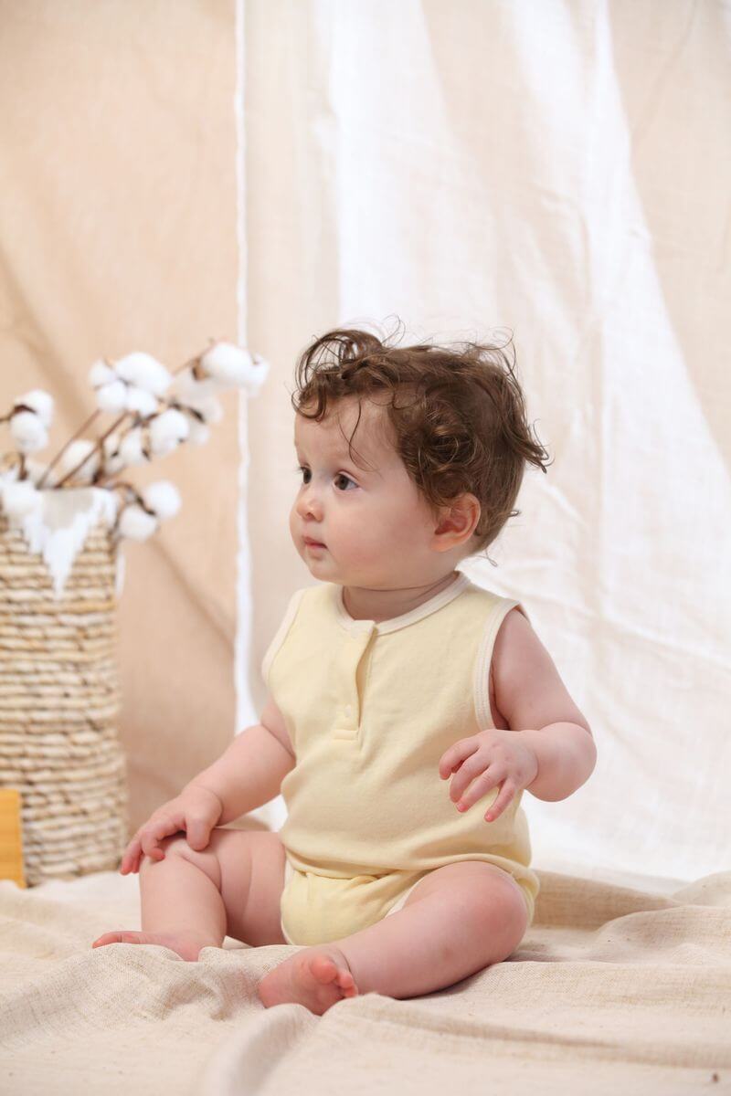 Blara Organic House | Sleeveless Henley Bodysuit | Creamy Yellow
